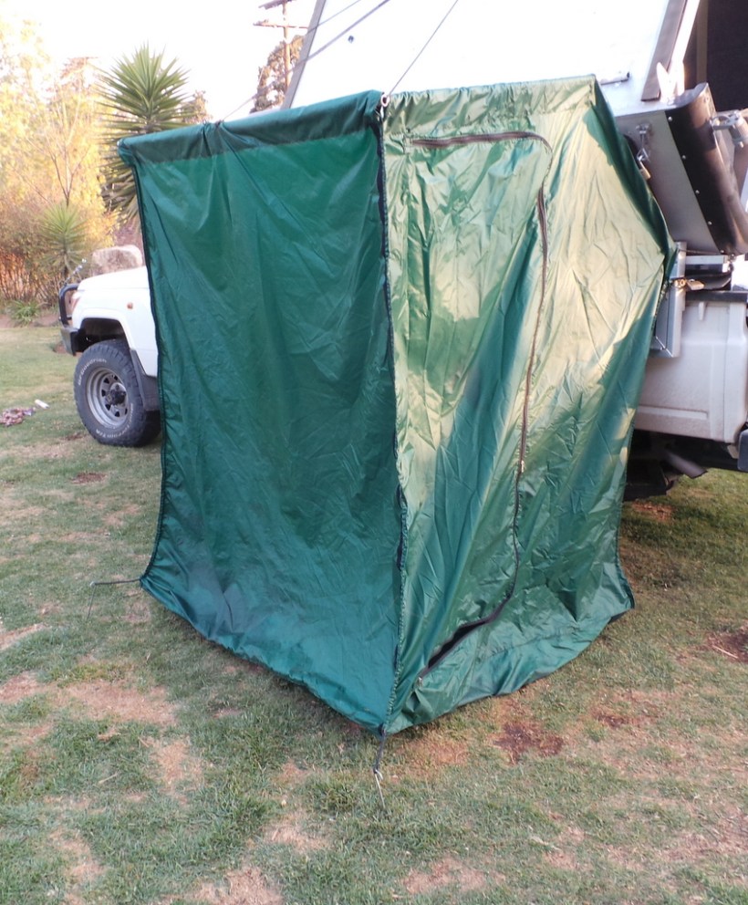 The shower curtain in the open position .